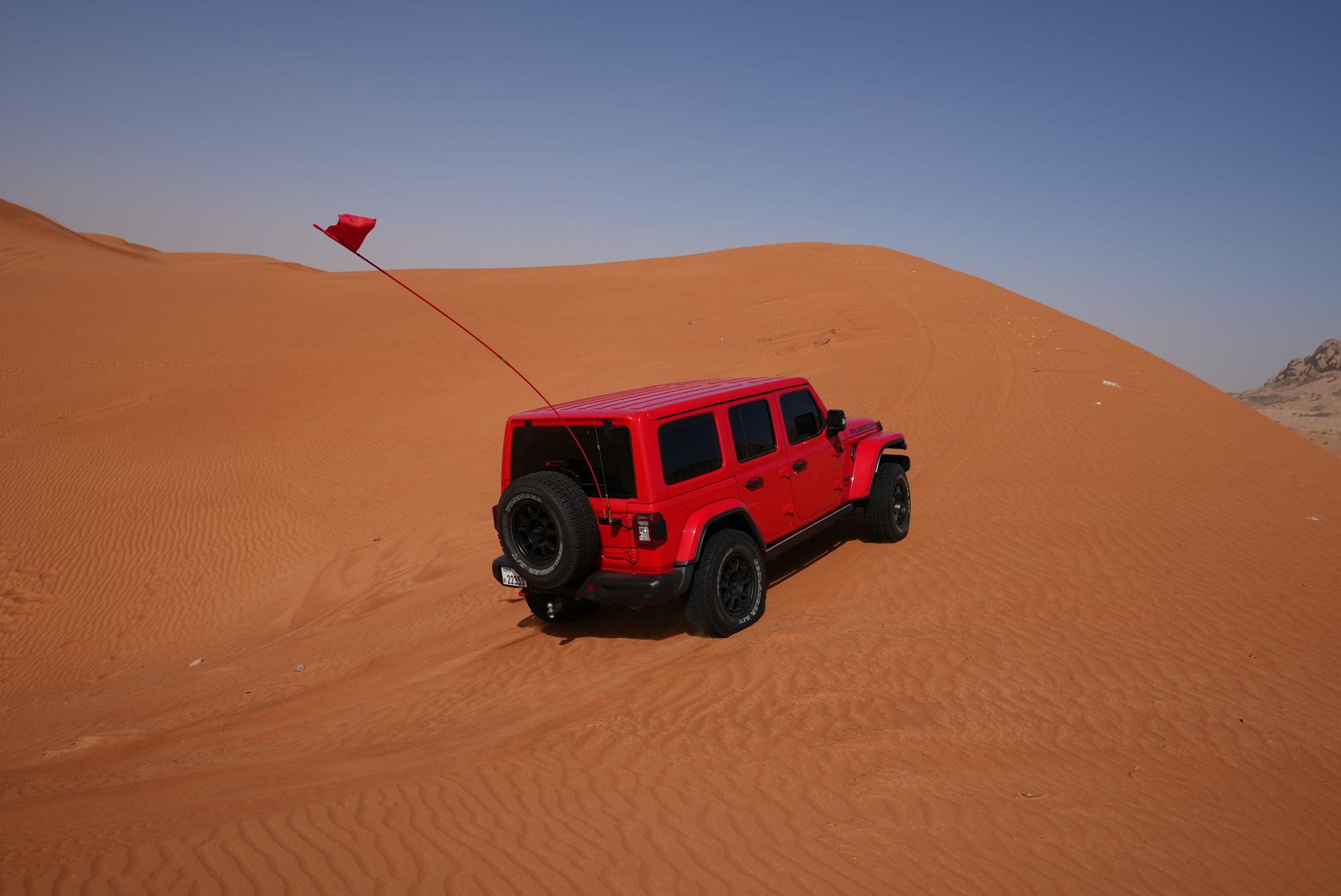 A 4x4 climbing the great dune of Erg Chegaga