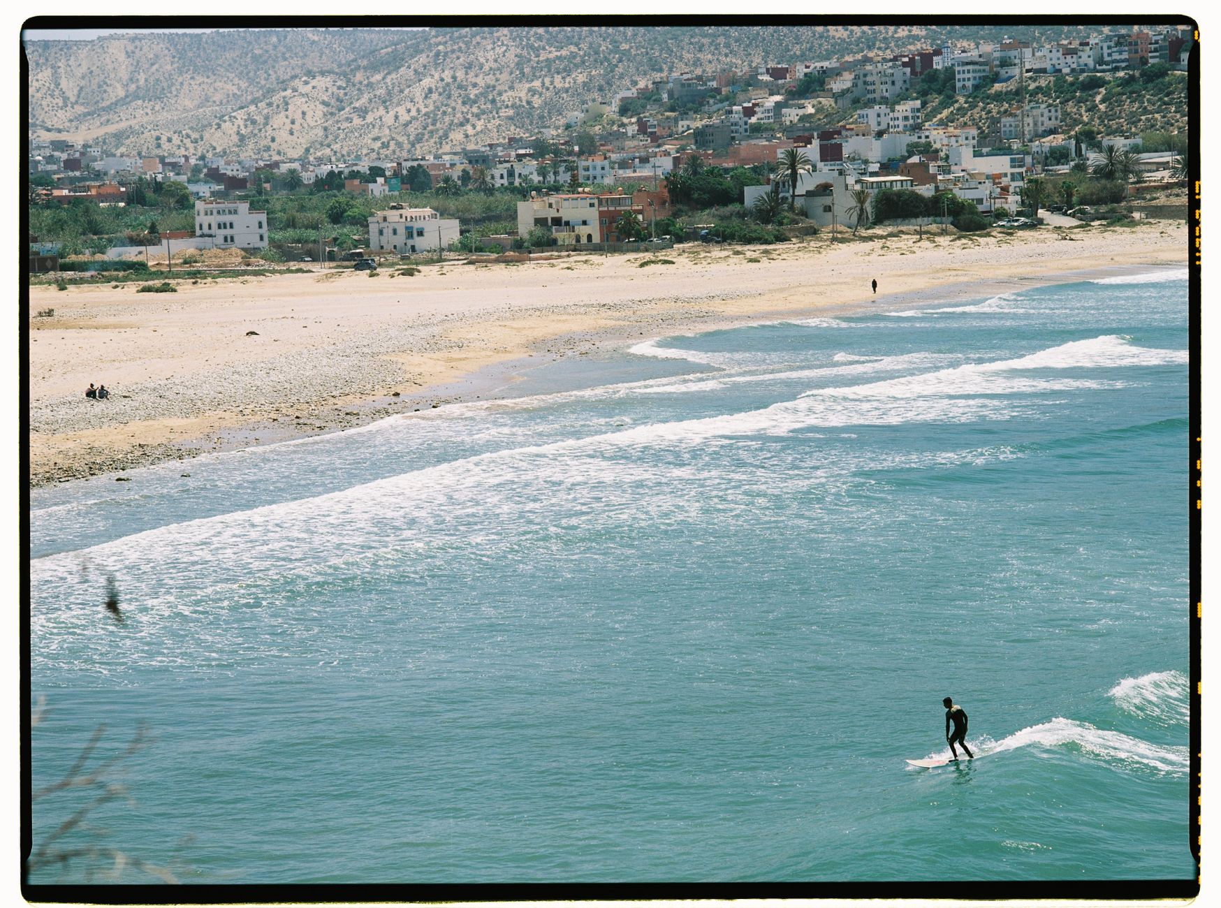 Surfer riding a wave near Agadir