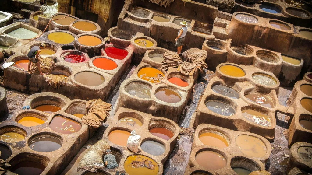 A narrow alley of the Fez medina at golden light